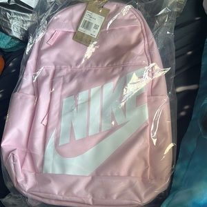 New pink nike back pack,three zipper pockets,two side pockets